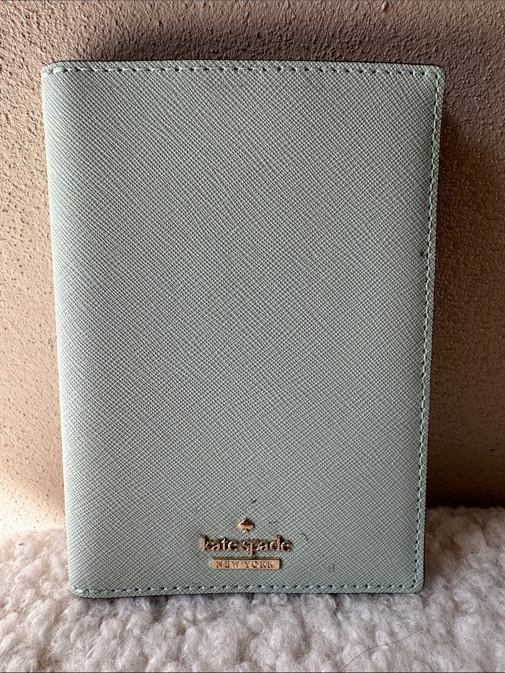 kate spade pale mint passport wallet with gold logo